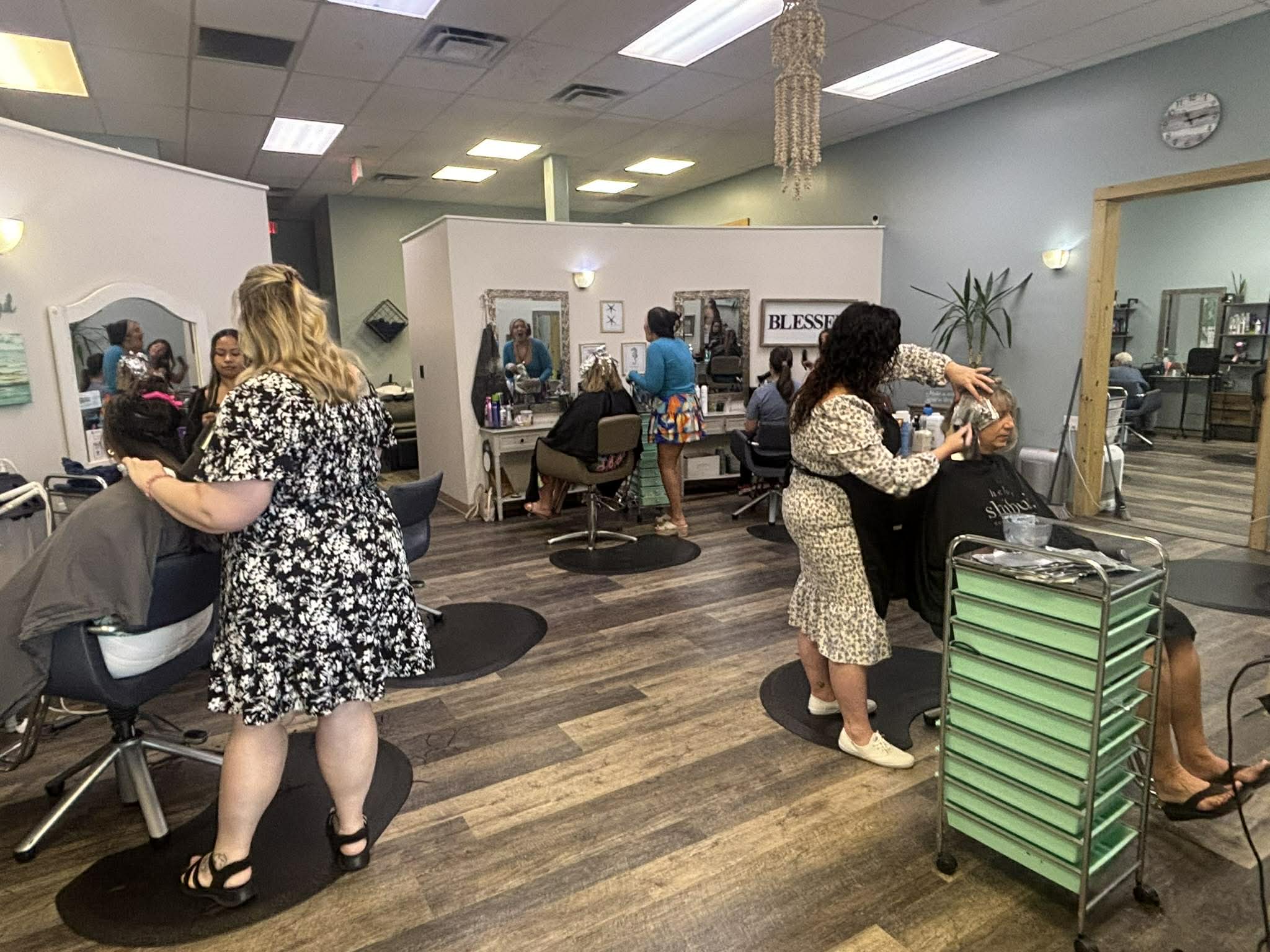 Professional salon product shelf at Coastal Roots Salon