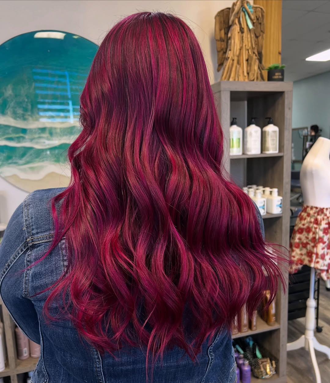 Pink fashion hair color at Coastal Roots Hair Salon