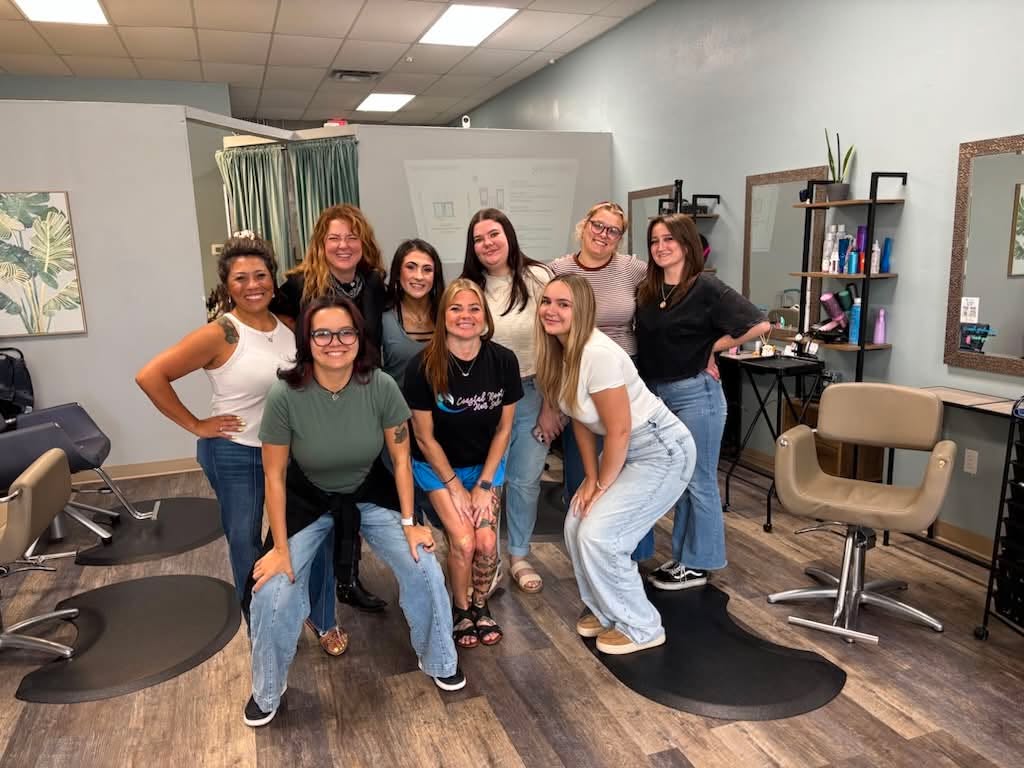 Coastal Roots Salon team attending a layering and product education session with R+Co educator @ravedogdoeshair